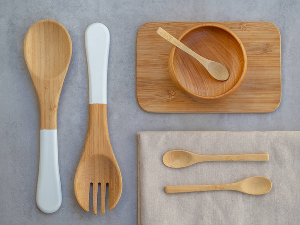Top view set of Eco friendly wooden and bamboo cutlery. Plastic free and zero waste concept - Фото, изображение