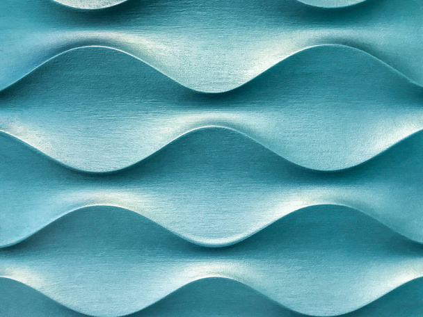 hellblaues 3d dekoratives Wandpaneel mit ungewöhnlicher geometrischer Form. - Foto, Bild
