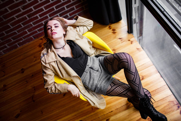 Autumn mood. Caucasian woman leans on chair. Youth concept - Fotoğraf, Görsel