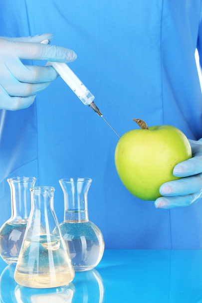 Scientists make injection into fresh apple in laboratory - Foto, Bild