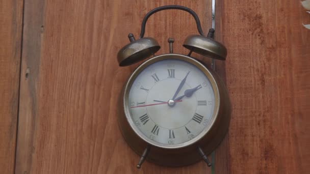 Vintage alarm clock on wooden background - Footage, Video