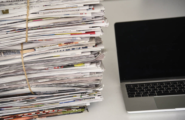 Newspapers and laptop. - Φωτογραφία, εικόνα