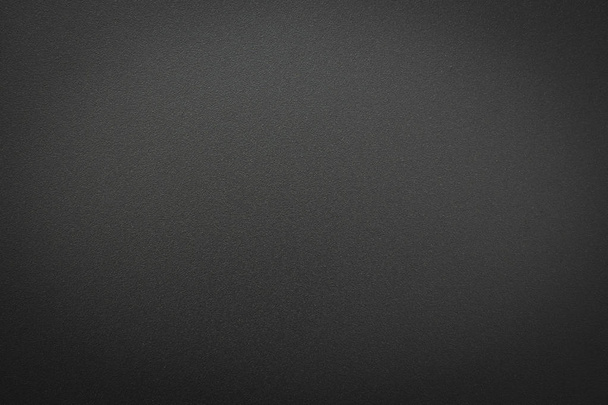 Primo piano della texture in metallo grigio nero. Superficie di sfondo opaco nero scuro astratto grezzo. Progettazione nello sfondo di lavoro, spazio di copia concettuale per il testo
. - Foto, immagini