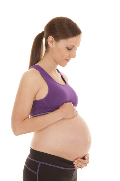 Pregnant fitness hold belly - Zdjęcie, obraz