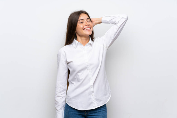 Young woman over isolated white background laughing - Fotografie, Obrázek