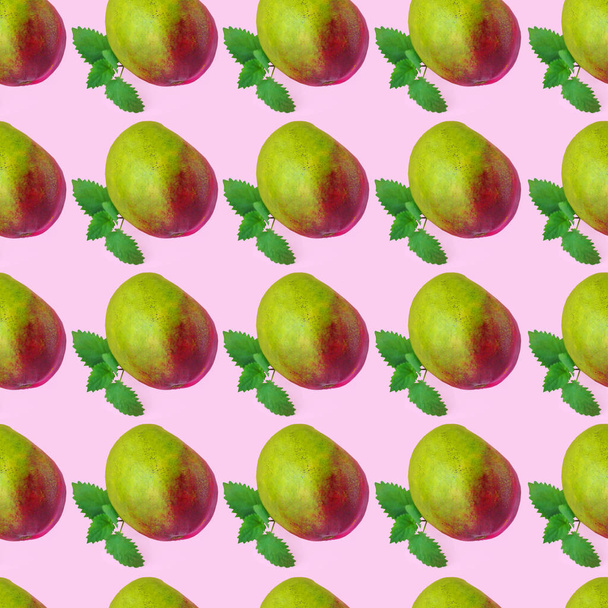 Mango seamless pattern with green mint leaves made of photography on pastel background. - Photo, Image