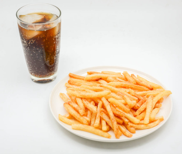 French fries on white dish and white background. - 写真・画像