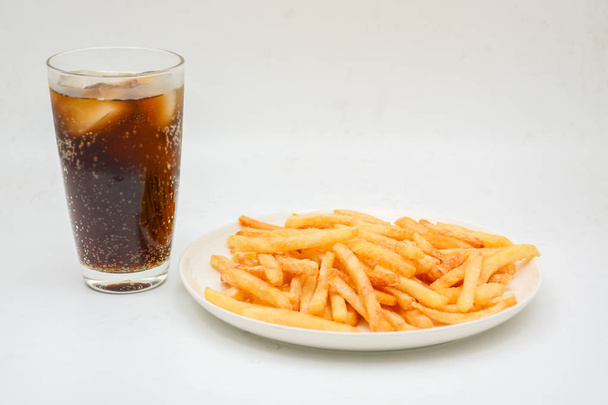 French fries on white dish and white background. - 写真・画像