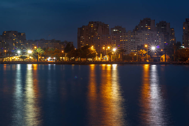 a wide long exposure cityscape shoot from izmir city - dark past - Photo, Image