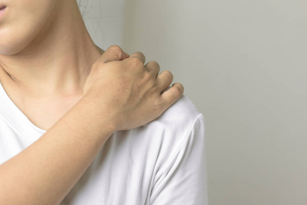 Woman with pain in shoulder. - Photo, image
