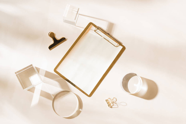 Knolling grid flatlay scene, white planner and gold stationery accessories, on a white desk background - Photo, Image