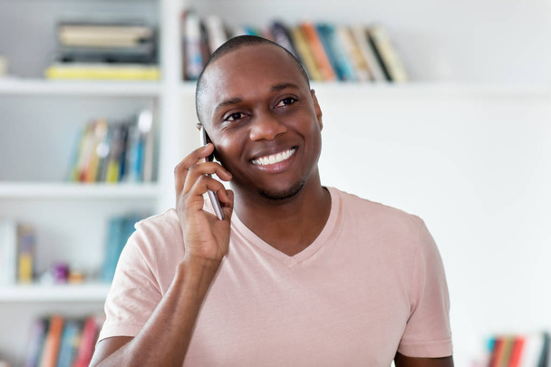 African american bald headed mature man at phone - Foto, Imagen