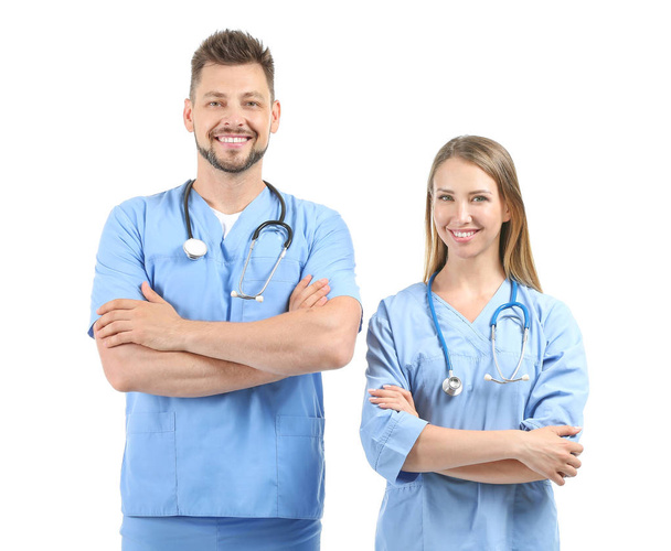 Pielęgniarki płci męskiej i żeńskiej na białym tle - Zdjęcie, obraz