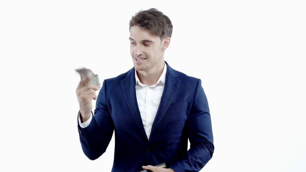 успешный бизнесмен берет деньги из бумажника изолированы на белом
 - Кадры, видео