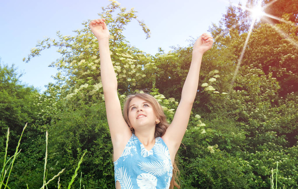 girl with raised arms - Photo, Image