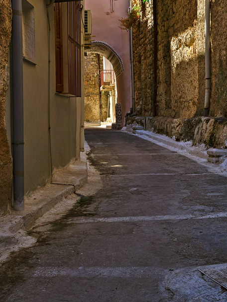 Narrow alley with decorated tunnel, in Pyrgi  medieval village, Chios island, Greece. - Photo, Image