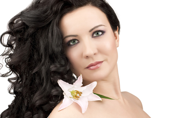 Women with a lily flower - Foto, Imagen