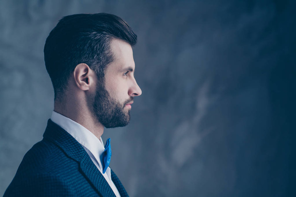 Profile side photo of minded man looking wearing modern blazer jacket isolated over grey background - Foto, afbeelding