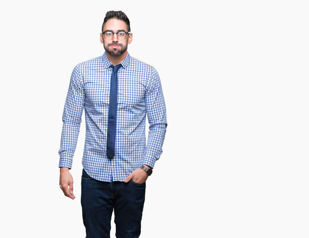 Young business man wearing glasses over isolated background puffing cheeks with funny face. Mouth inflated with air, crazy expression. - Fotoğraf, Görsel