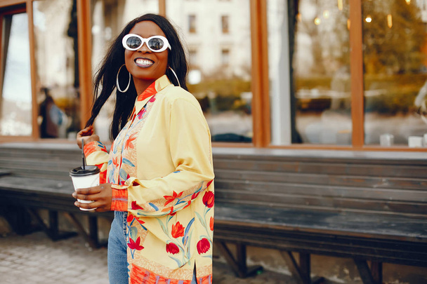 stylish black girl in a city - Photo, image