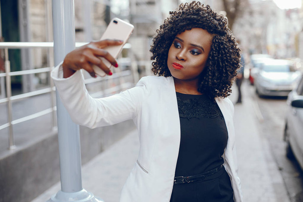 stylish black girl in a city - Photo, image