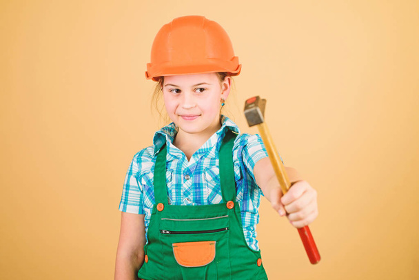 Labor day. 1 may. Foreman inspector. Repair. Safety expert. Future profession. small girl repairing in workshop. Little girl in helmet with hammer. Kid worker in hard hat. Working in repair shop - Fotó, kép