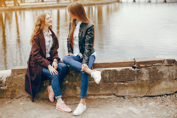 two stylish girl near river - Zdjęcie, obraz