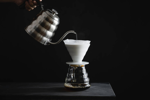 Coffee, black coffee, drip coffee, making coffee in low-light  - Zdjęcie, obraz
