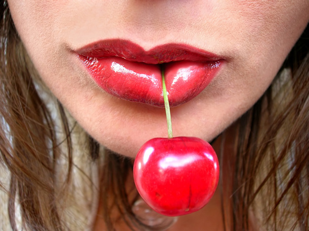 Red cherry in red lips - Photo, Image