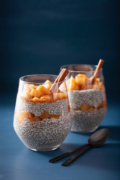chia pudding with cinnamon simmered apples and peanut butter - Foto, afbeelding