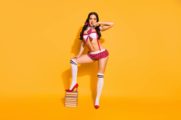 Full length photo of naked tender lady stand book pile prepare private exam boyfriend wear red mini suit isolated yellow background - Foto, imagen