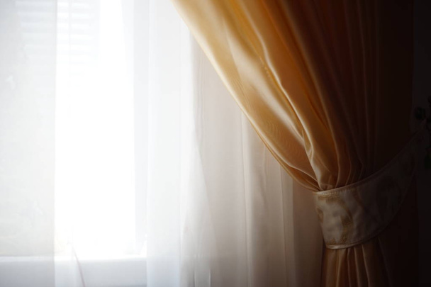 White tulle with a brown curtain fixed holder - Foto, Imagem