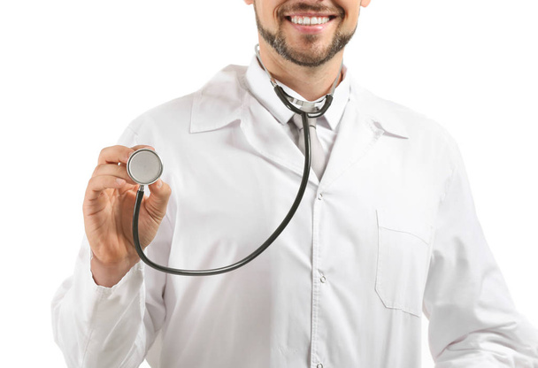 Male doctor with stethoscope on white background - 写真・画像
