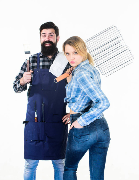 Perfect summer lunch. Tools for roasting meat. Man bearded hipster and girl. Preparation and culinary. Family weekend. Couple in love hold kitchen utensils. Picnic barbecue. food cooking recipe - Valokuva, kuva