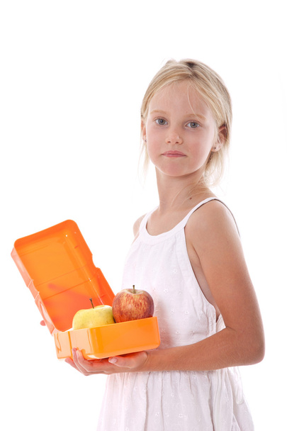 young girl with lunchbox containing apples - Foto, Bild