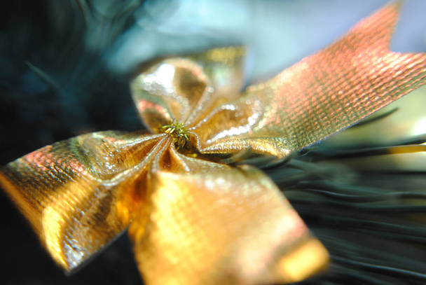 Christmas gold bow, Christmas decorations. - Photo, Image