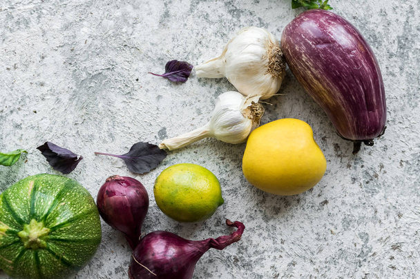 Flat-lay of green and purple raw vegetables - Photo, Image