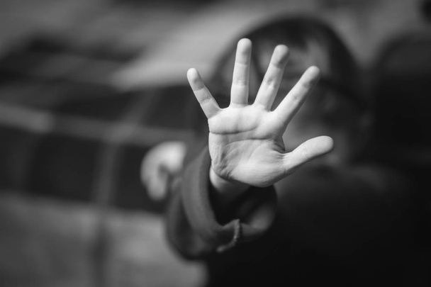 Stop hand of child, sign of discrimination or anti violence symbol.black and white. - Photo, Image