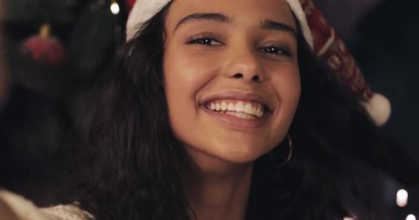 Close Up Smartphone Camera View of Young Happy Mulatto Girl wearing Santas Hat, Posing, Making Selfie. Happy Holiday Concept. - Filmagem, Vídeo