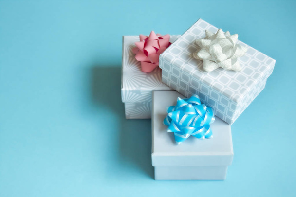 Gift boxes on blue background. - Photo, image