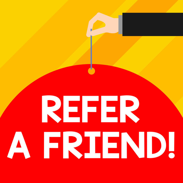 Writing note showing Refer A Friend. Business photo showcasing direct someone to another or send him something like gift Male hand arm needle punching big blank balloon geometrical background. - Photo, Image