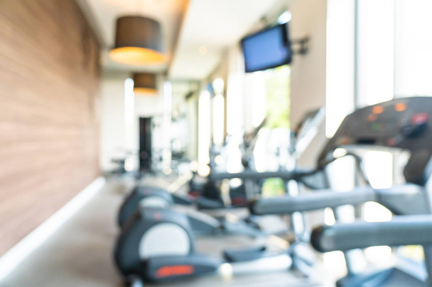 Abstract and defocused fitness equipment in gym interior room - Photo, Image