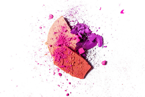 Crushed eyeshadow palette and powder close-up isolated on white  - 写真・画像