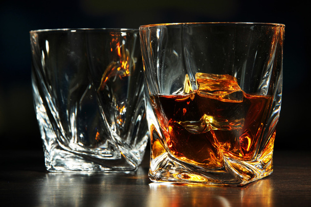 Glasses of whiskey, on dark background - Foto, Imagen