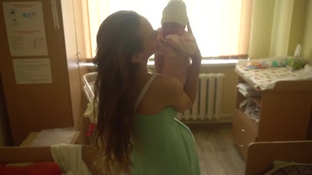 beautiful young mom with newborn baby - Felvétel, videó