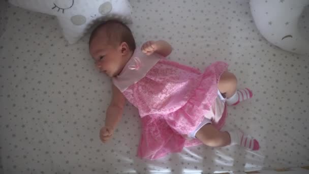close up of Cute little newborn girl in pink dress - Video