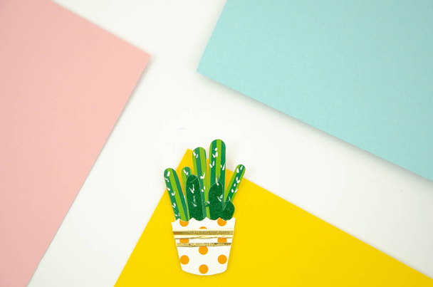 Flat lay paper cactus In a colorful potson a pop style pink, yellow and blue background - Photo, Image