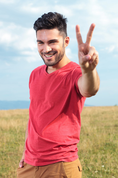 casual man shows victory sign - Photo, Image