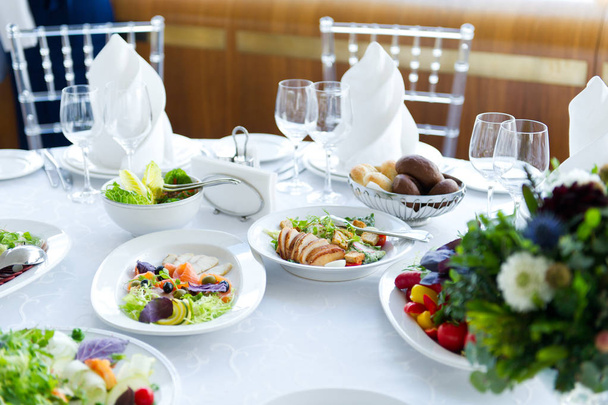 salads on a white table in a restaurant - Fotoğraf, Görsel