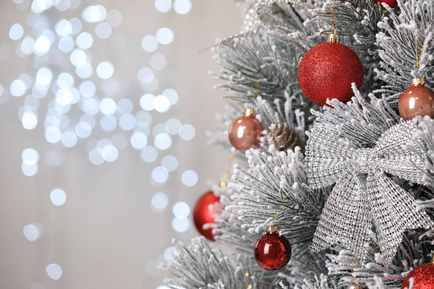 Beautiful Christmas tree with festive decor against blurred lights on background. Space for text - Fotografie, Obrázek